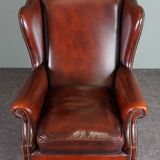 Leather armchair with decorative nails
