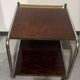 1970s/80s coffee table on casters with metal tubing, light-colored door