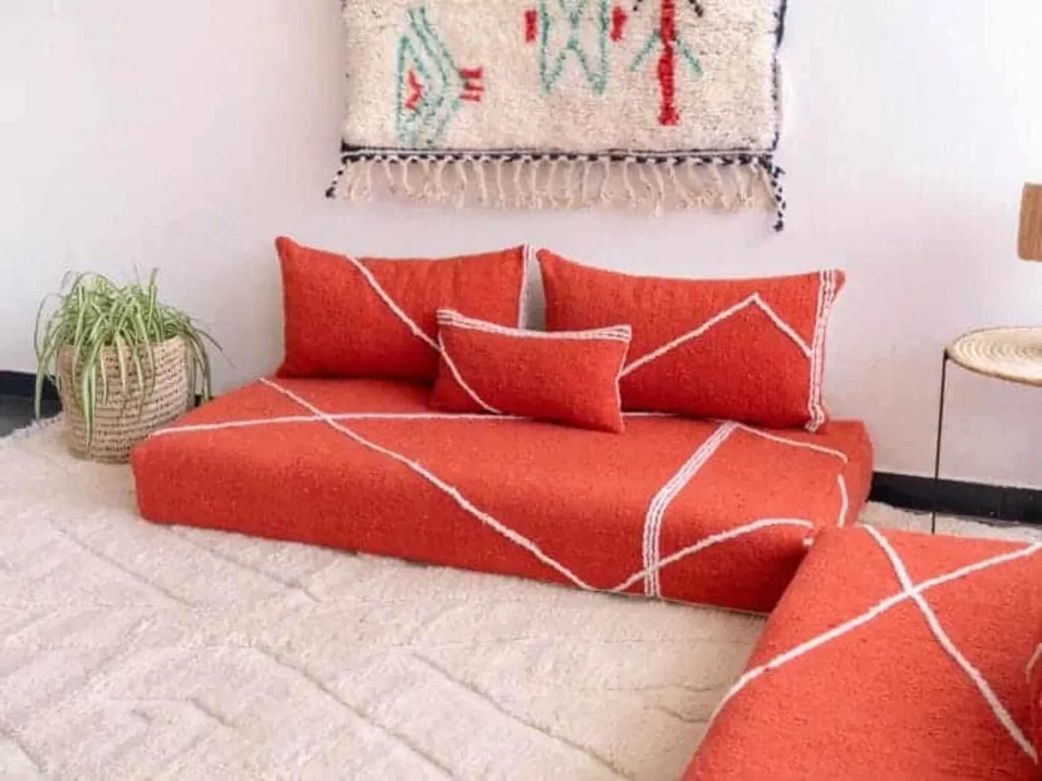 Handmade Moroccan floor cushion in orange cotton.