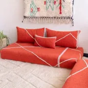 Handmade Moroccan floor cushion in orange cotton.