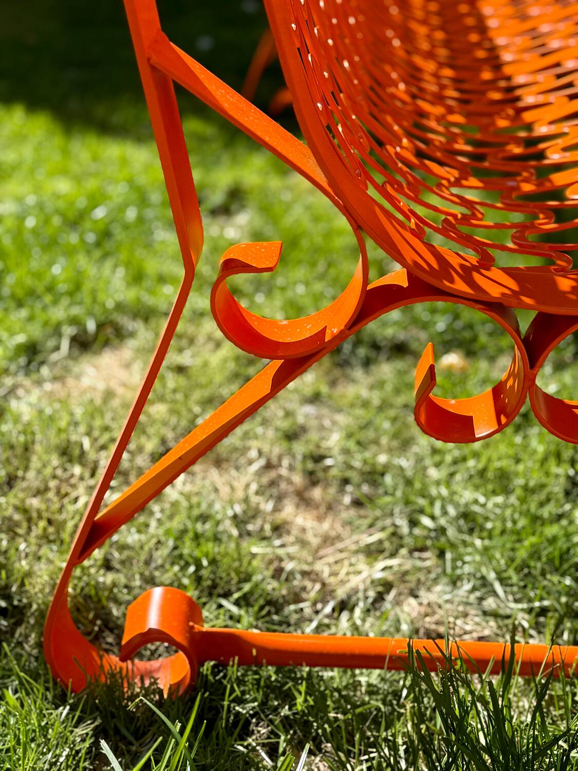 Orange pierced sheet metal bench