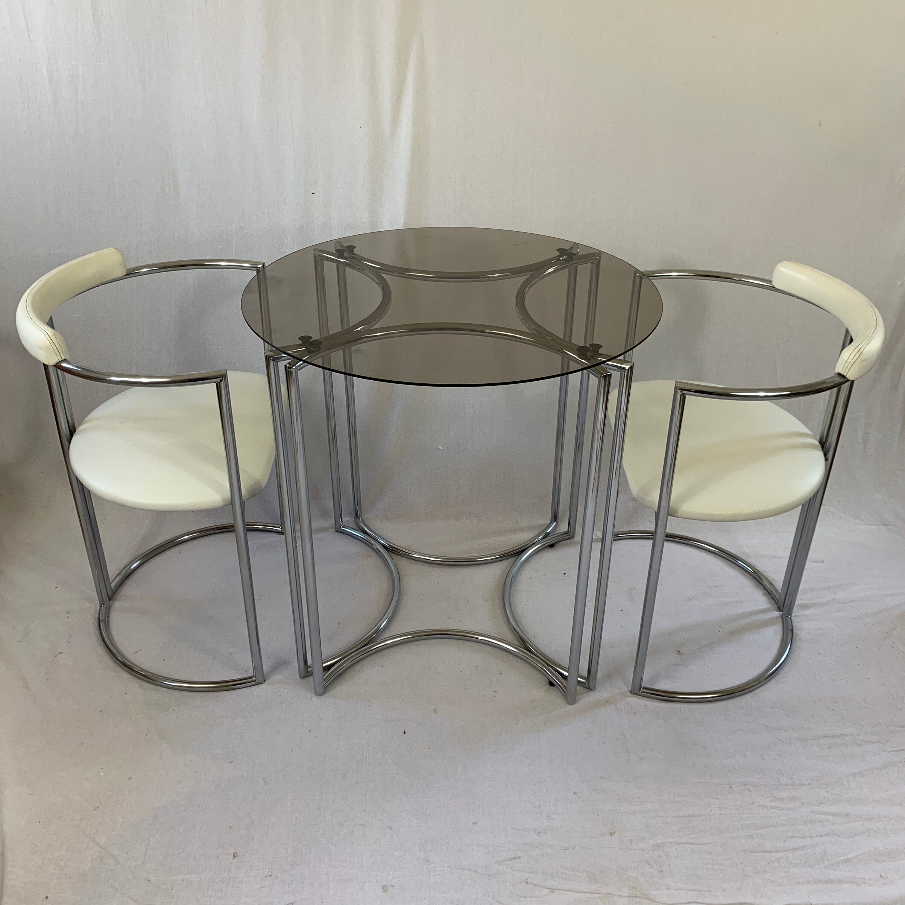 Chrome table and two modernist chairs