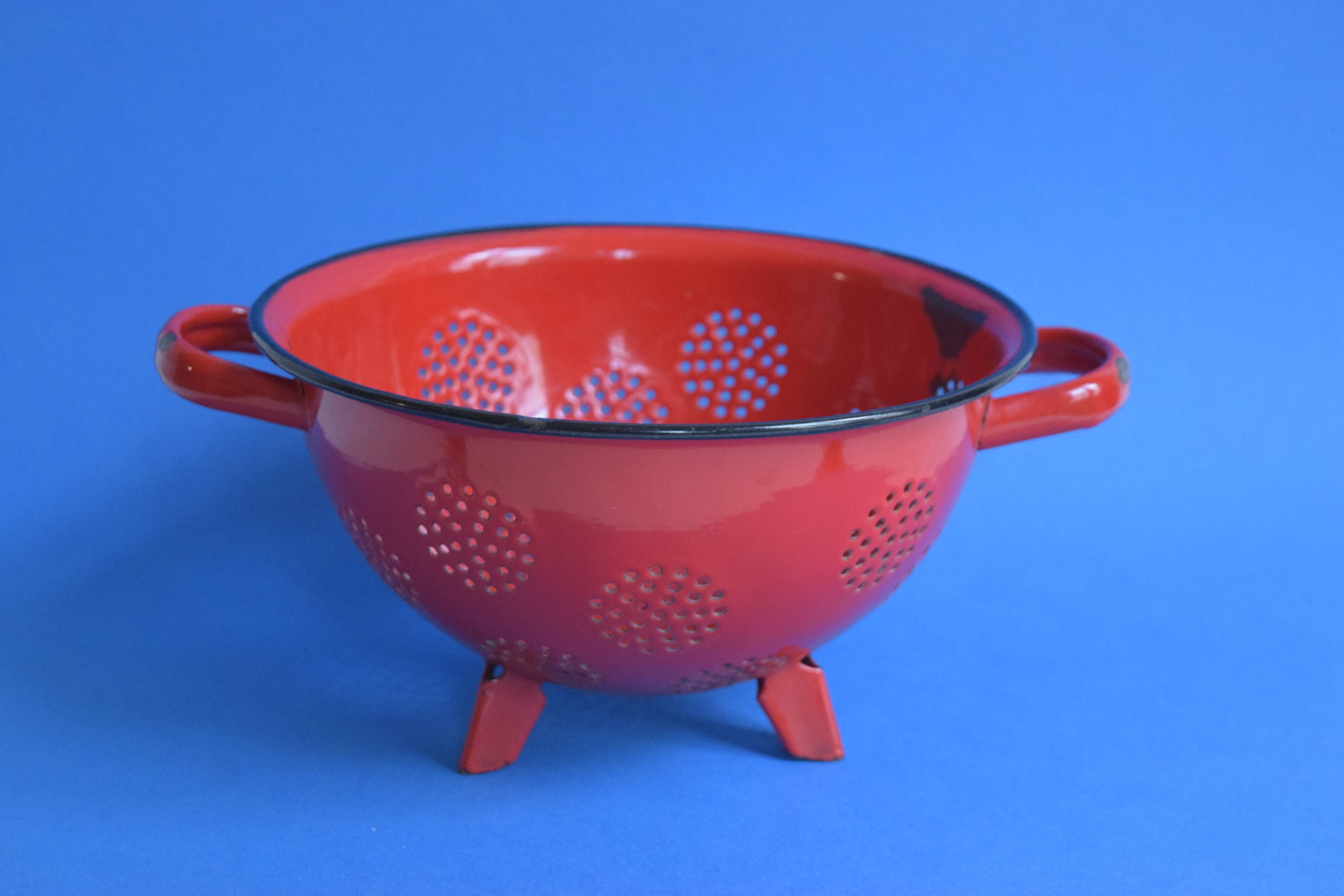 Vintage red enameled sheet metal colander