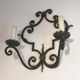 Paire d'importantes appliques décoratives en fer forgé