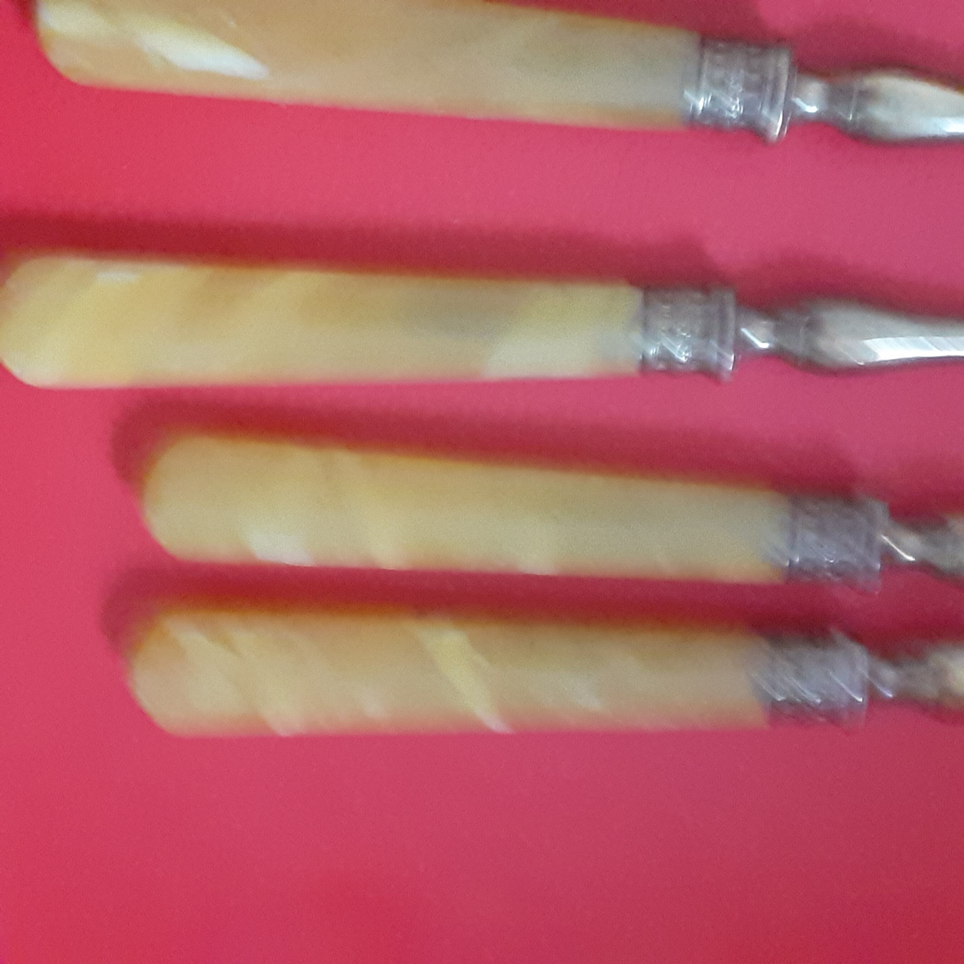12 Cake forks. Around 1930. Golden metal and yellow Bakelite handle.
