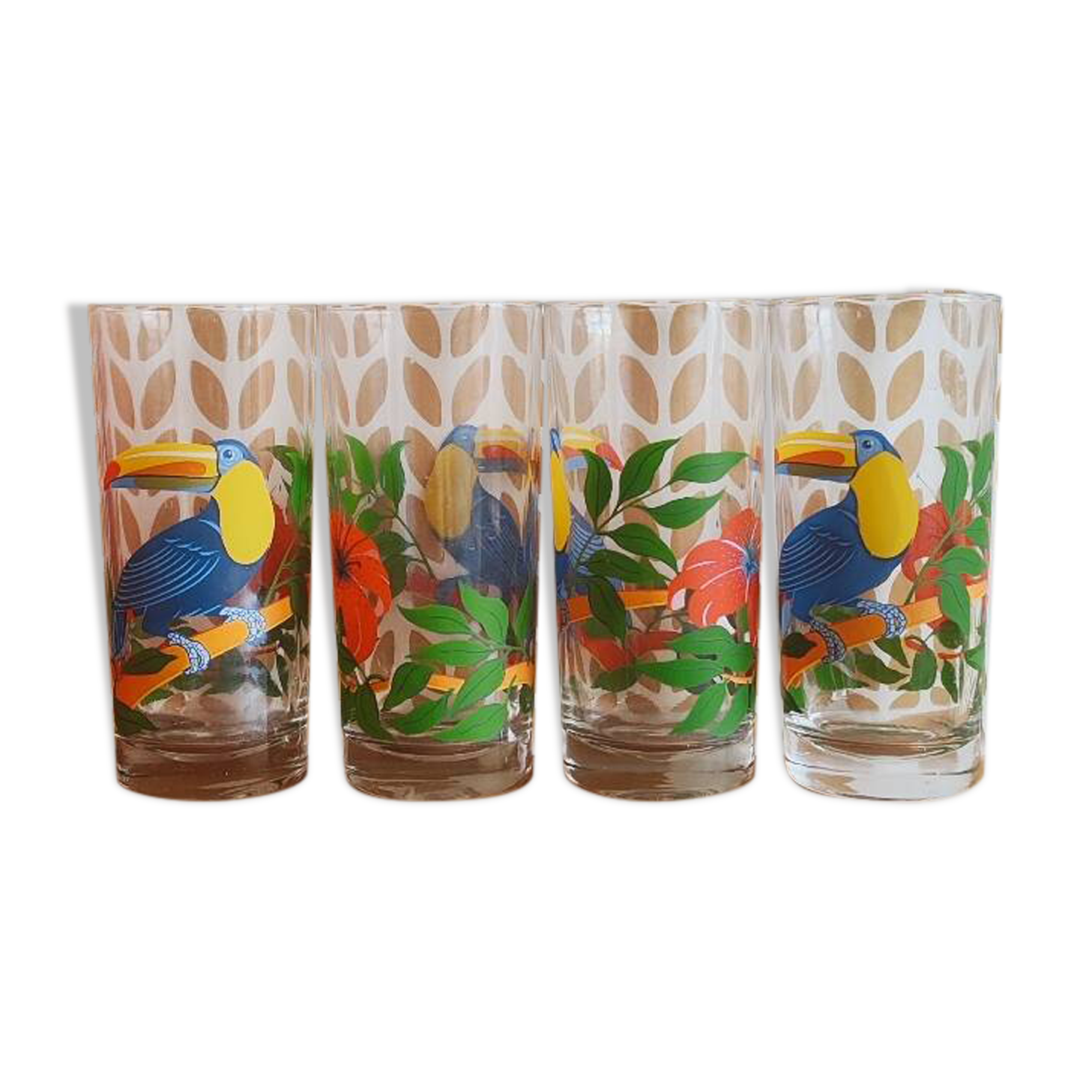 Vintage lemonade glasses with tropical parrot and flower patterns.