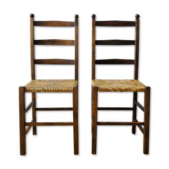 Pair of rustic wooden chairs and mulched seats