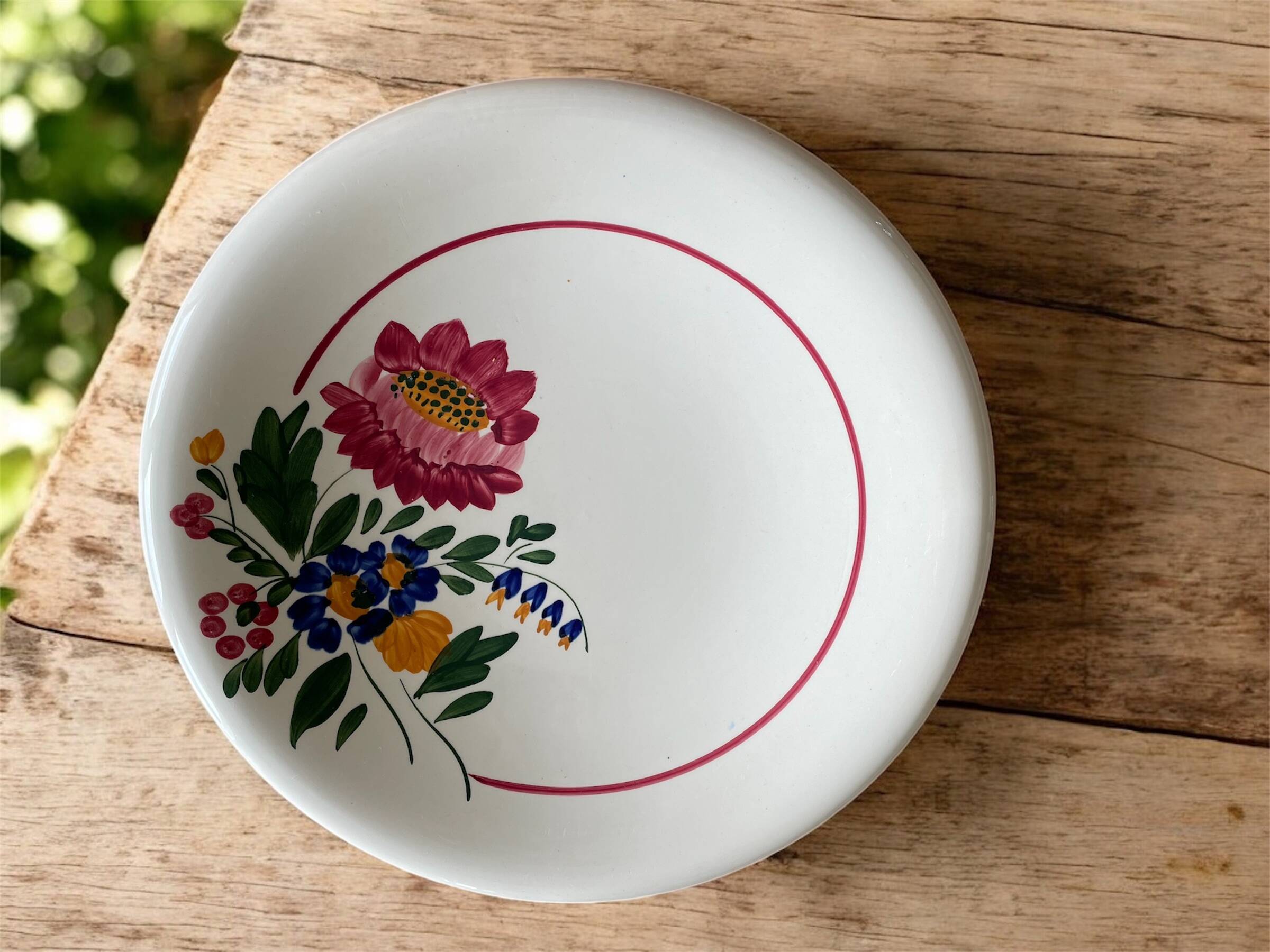 Large antique salad bowl on a pedestal, made of Sarreguemines earthenware.