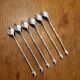 6 long silver-plated metal spoons