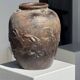Large traditional Indonesian clay pot featuring a dragon.
