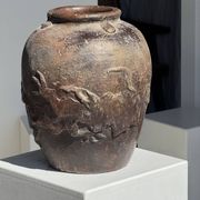 Large traditional Indonesian clay pot featuring a dragon.