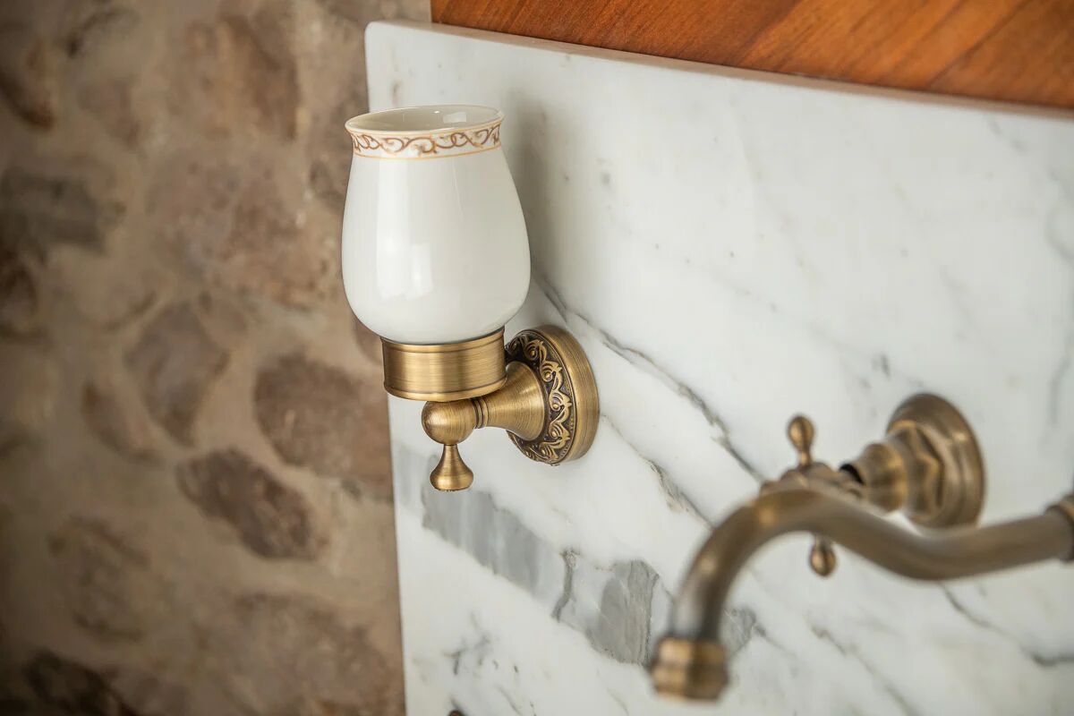 Antique washbasin cabinet from 1928 in wood and marble with a lighted mirror.