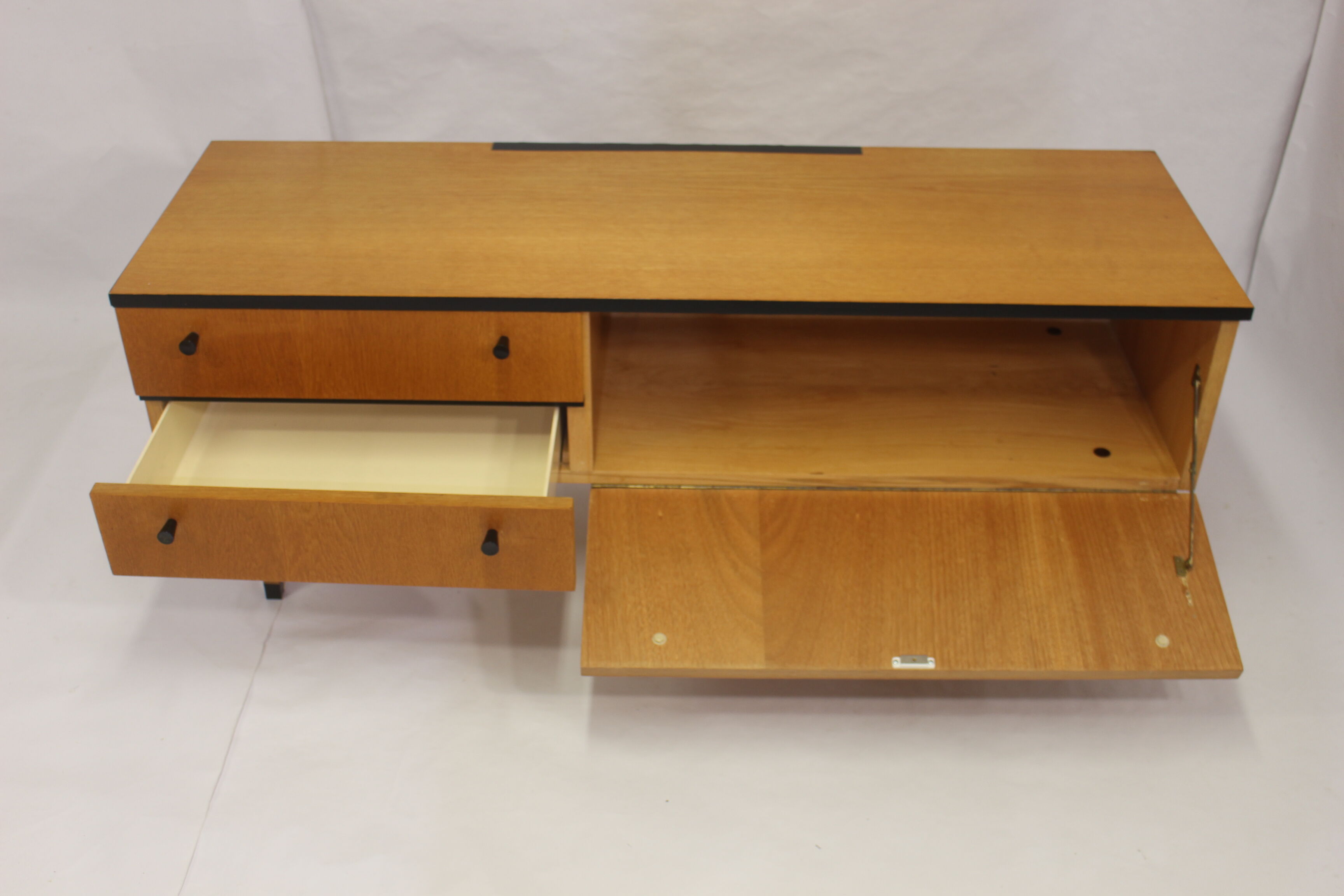 Black-gloved 50s varnished wooden sideboard