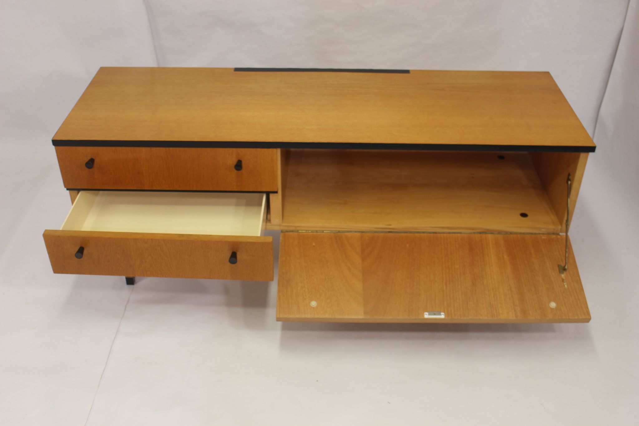 Black-gloved 50s varnished wooden sideboard