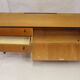 Black-gloved 50s varnished wooden sideboard