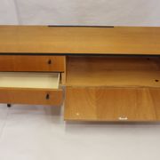 Black-gloved 50s varnished wooden sideboard