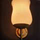 Pair of vintage gold-tone wall sconces with opaline glass globes