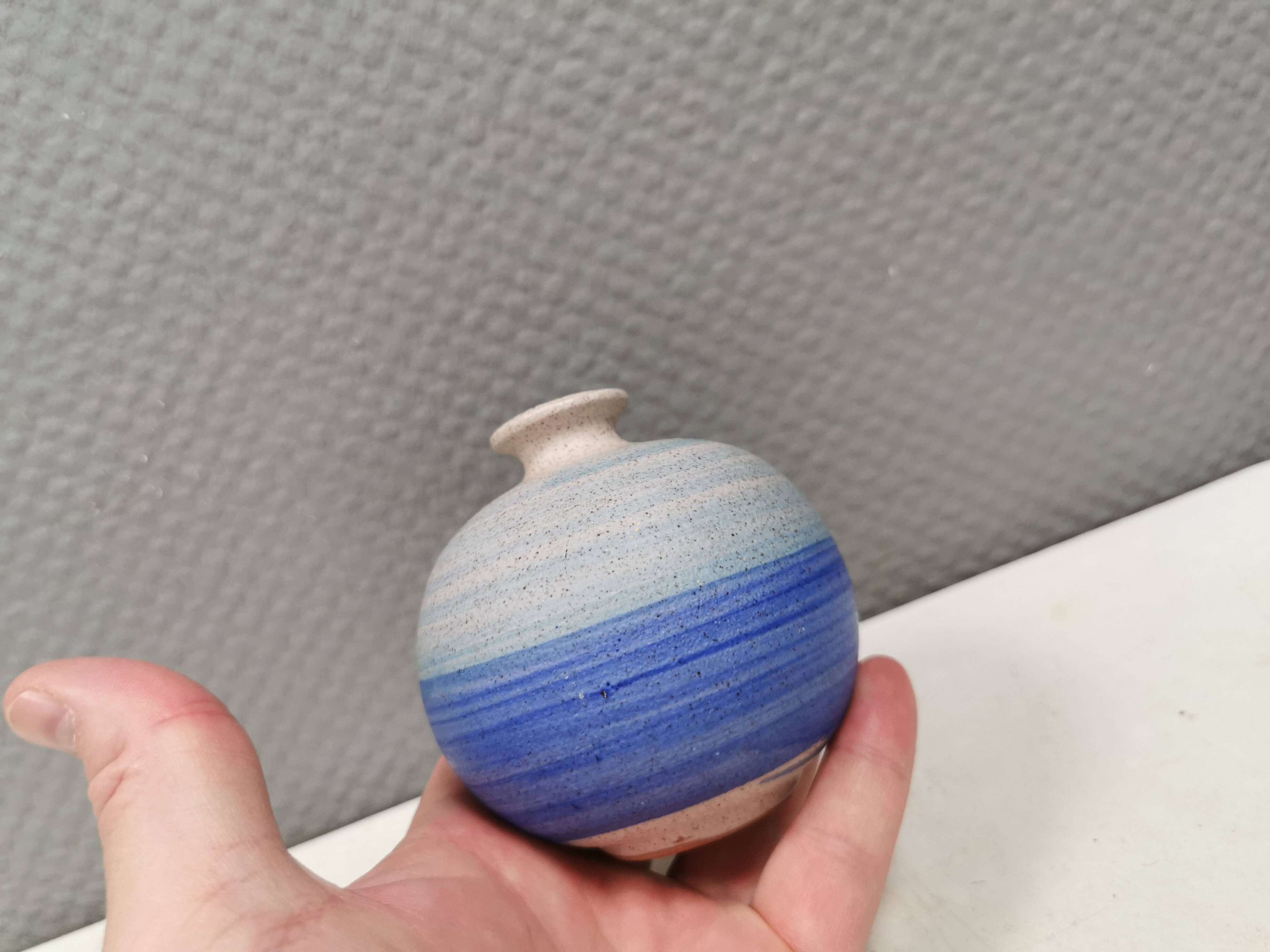 A small, round, beautiful ceramic vase from Denmark, dating from the 1980s.