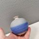 A small, round, beautiful ceramic vase from Denmark, dating from the 1980s.