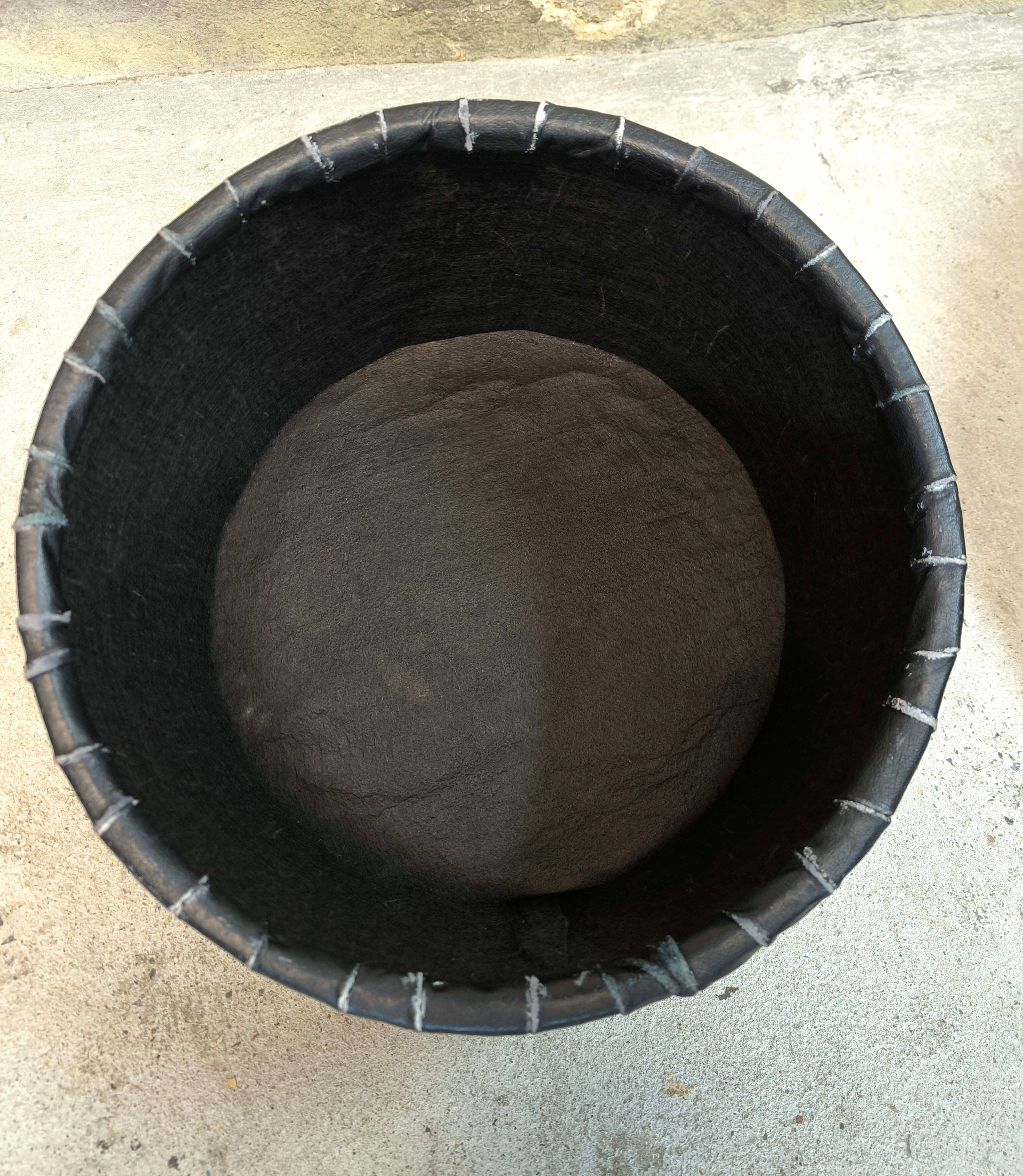 Vintage De Sede black leather storage pouf.