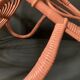 Vintage pink rattan armchair