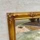 Miroir biseauté en bois doré