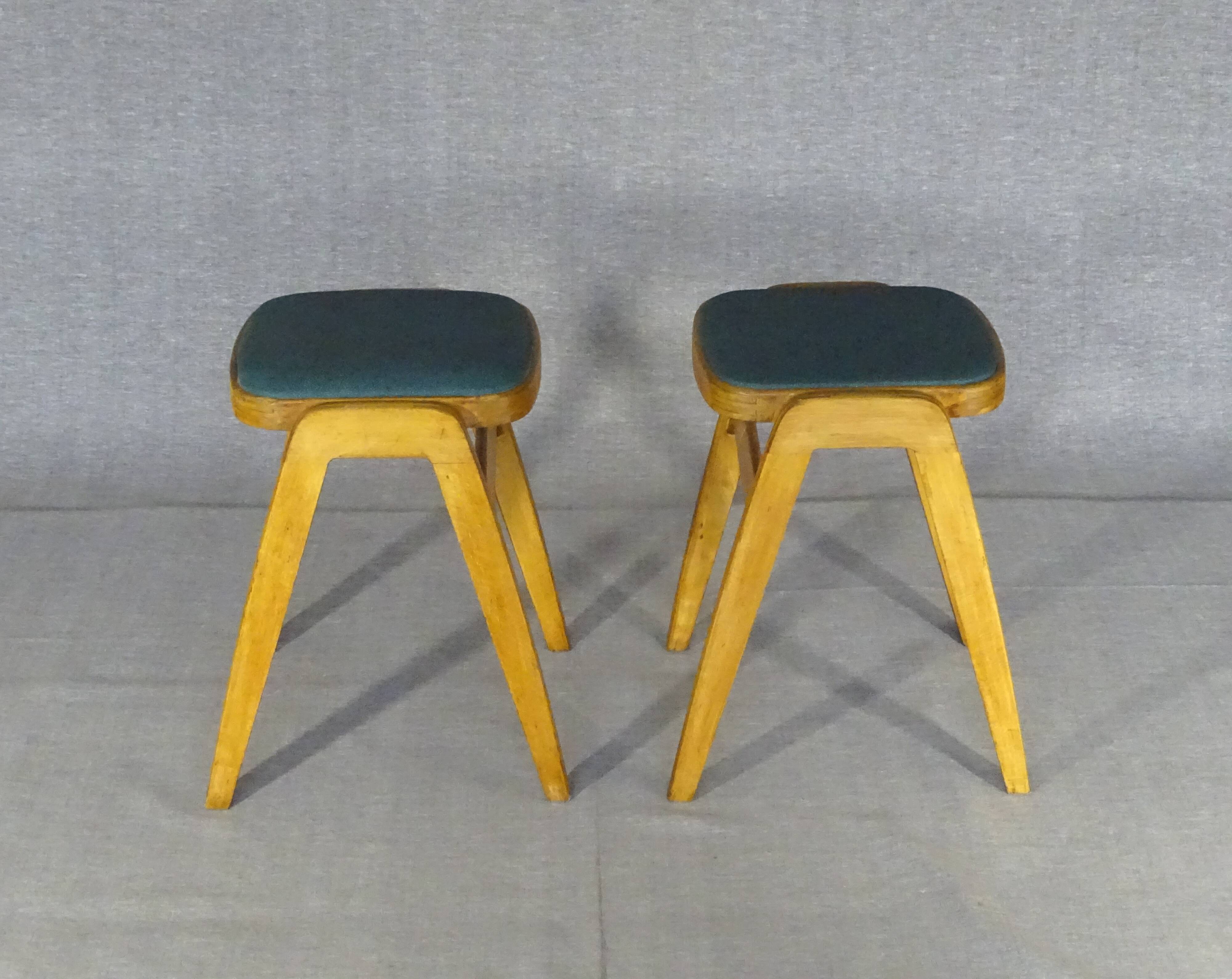 2 Mid-century green vinyl stools with compass legs from the 1960s.