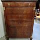 Mahogany chest of drawers – Empire / Restoration period – Black marble and bronze