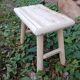 Small stool in raw wood