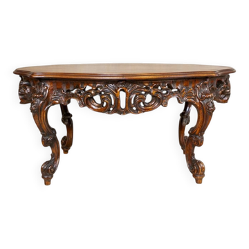 Vintage brown wooden coffee table with a carved apron, 1940s.