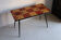 Vintage coffee table in laminate with geometric design, with tapered legs.