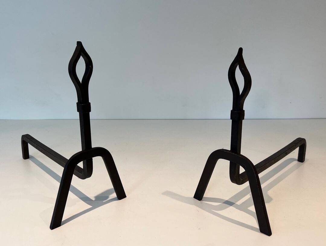 Pair of Modernist Andirons in Wrought Iron with Stylised Torches and Bases Ang
