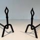 Pair of Modernist Andirons in Wrought Iron with Stylised Torches and Bases Ang
