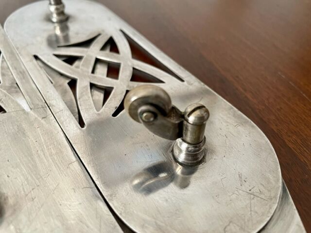 Art nouveau silver metal underside, retractable