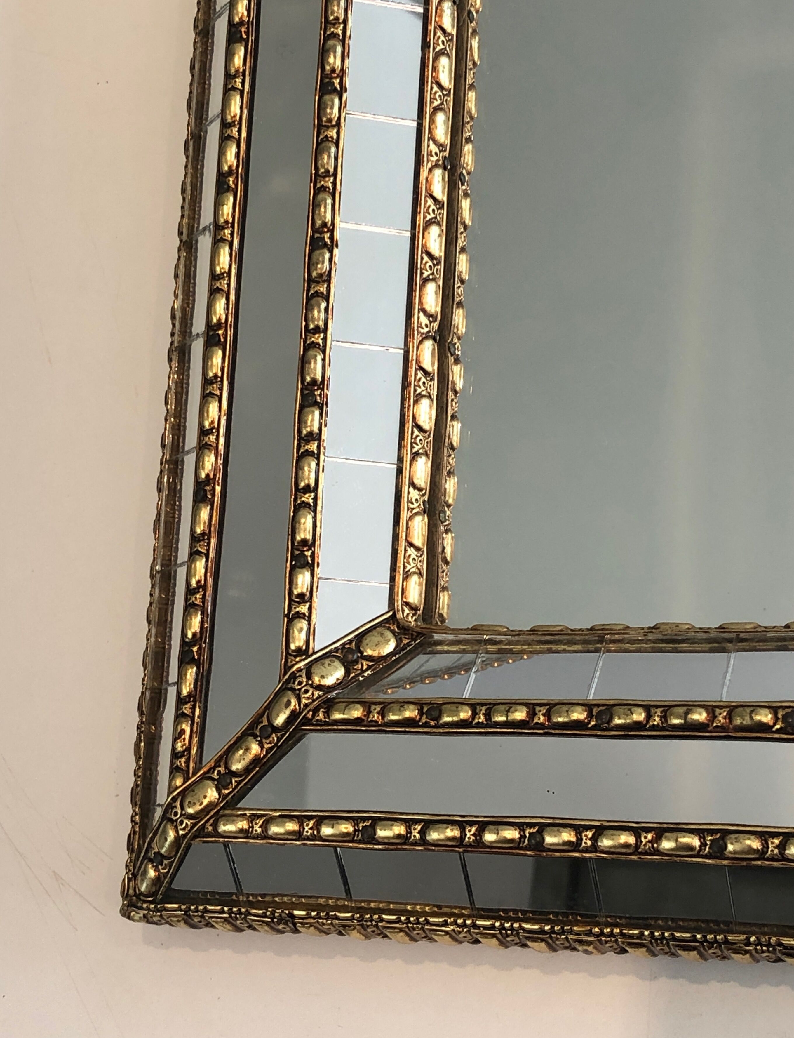 Mirror consisting of multi-faceted mirrors and brass garlands, French work, around 1970