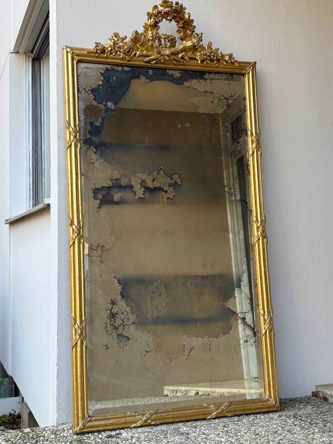 Large Louis XVI style gilded mirror, 19th century