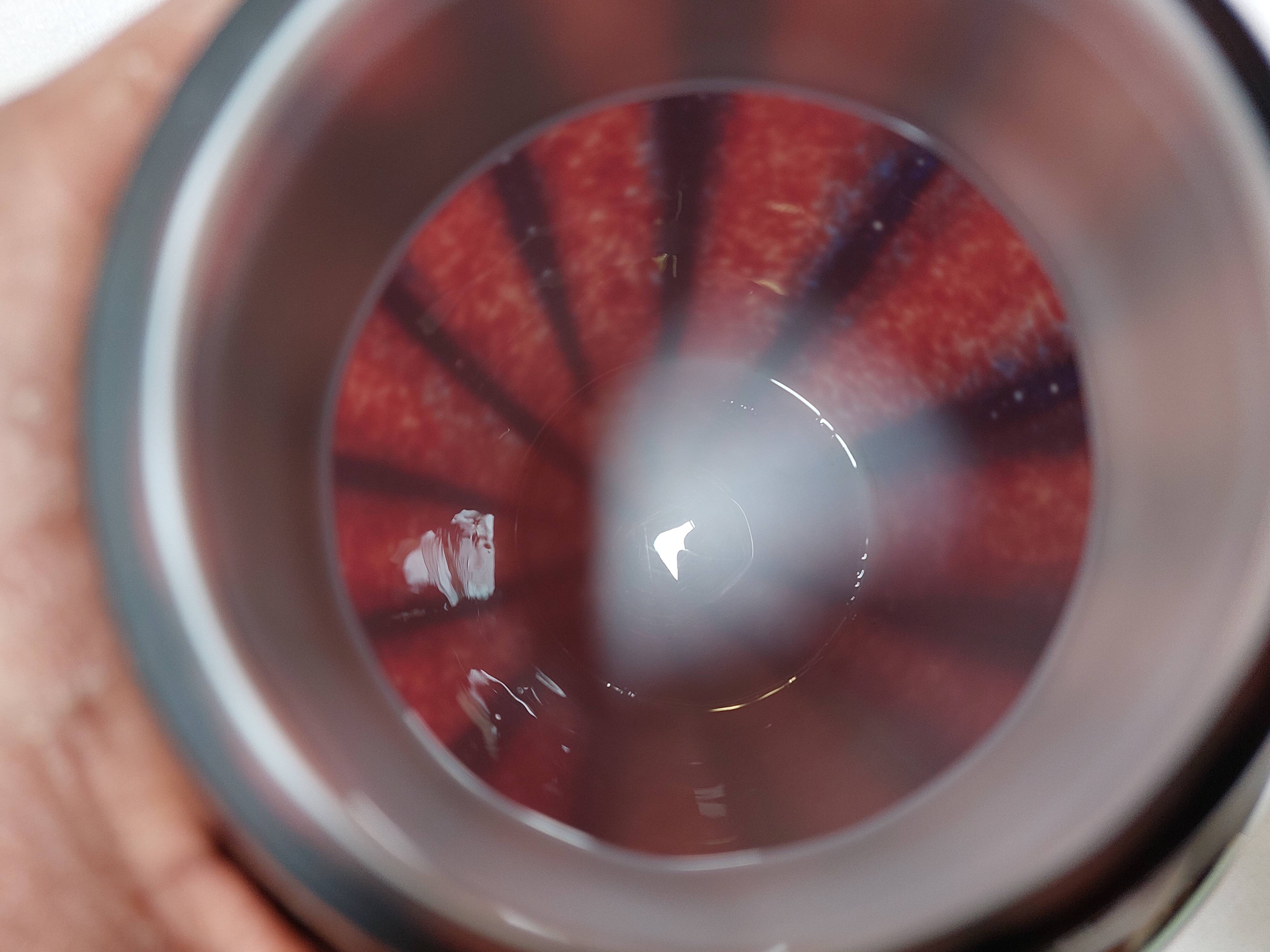 Large vintage blown glass ball vase with red and midnight blue flamed decor