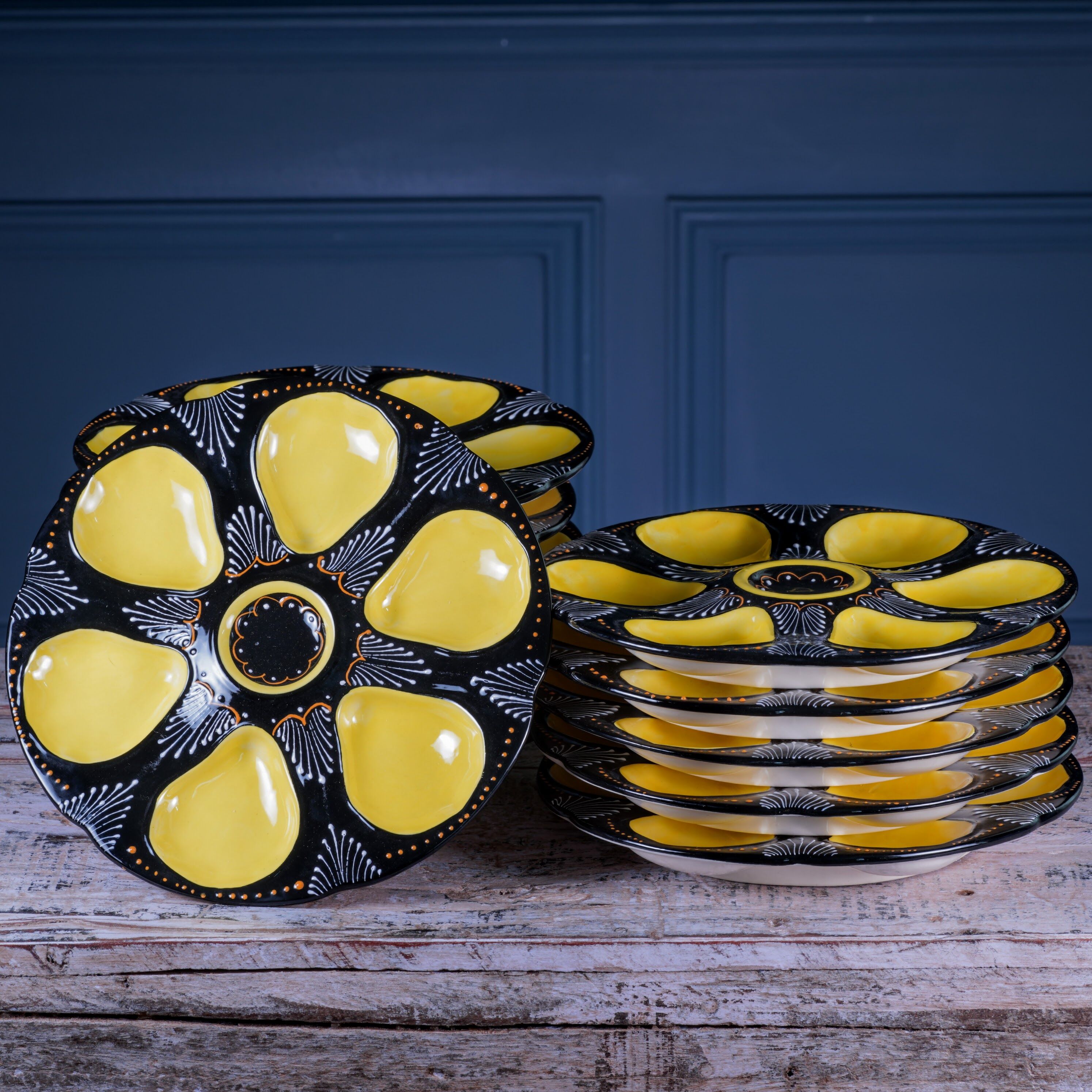 Set of twelve handpainted Brittany yellow, cream and black oyster plates