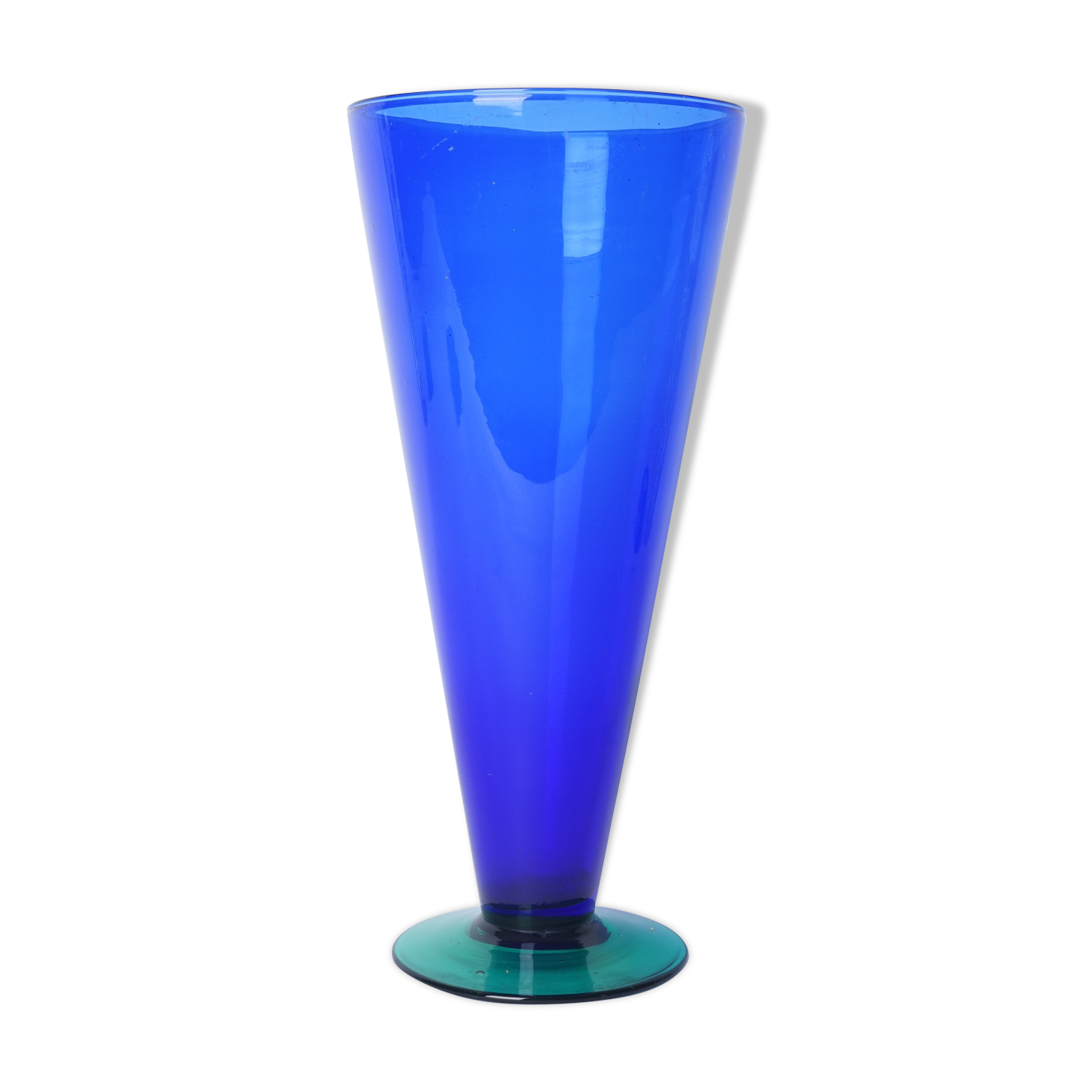 Blue glass vase with green foot