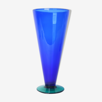 Blue glass vase with green foot