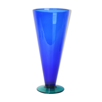 Blue glass vase with green foot