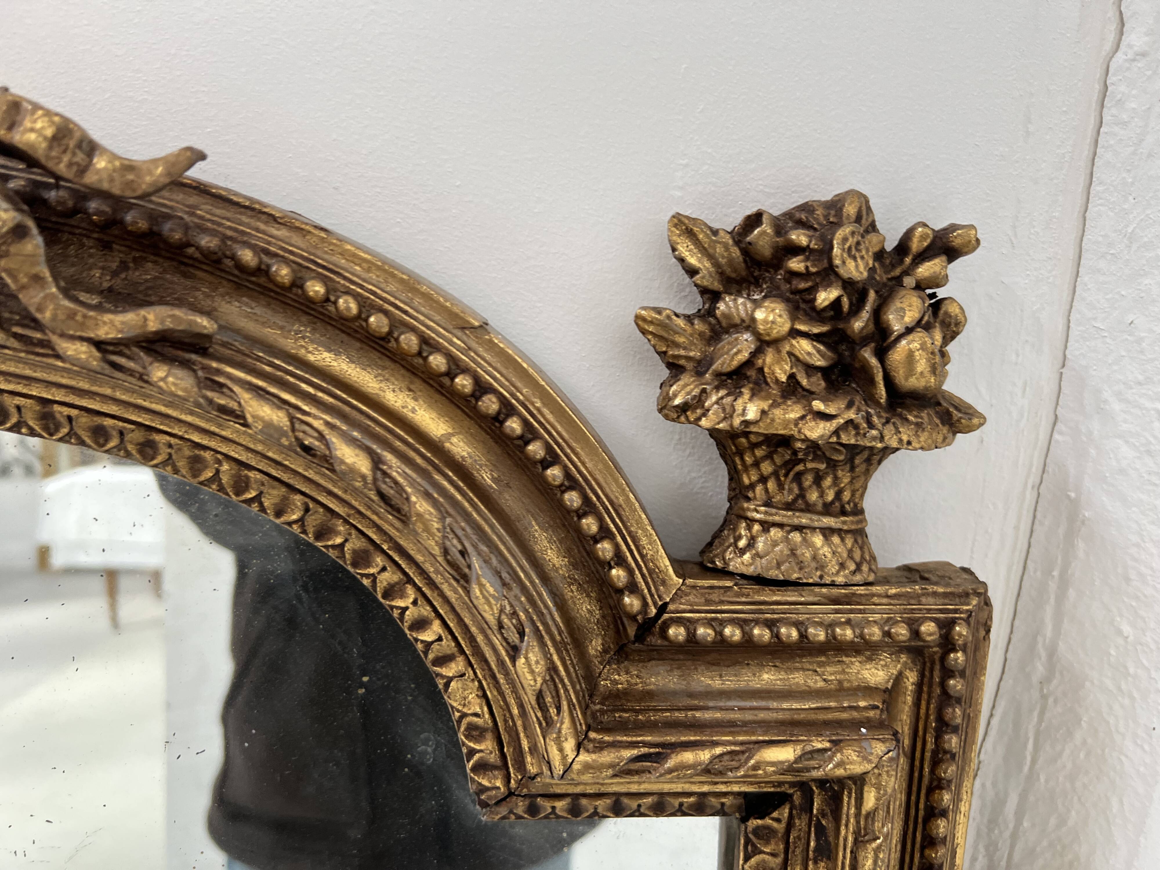 Louis XVI style mirror in wood and gilded stucco, 19th century