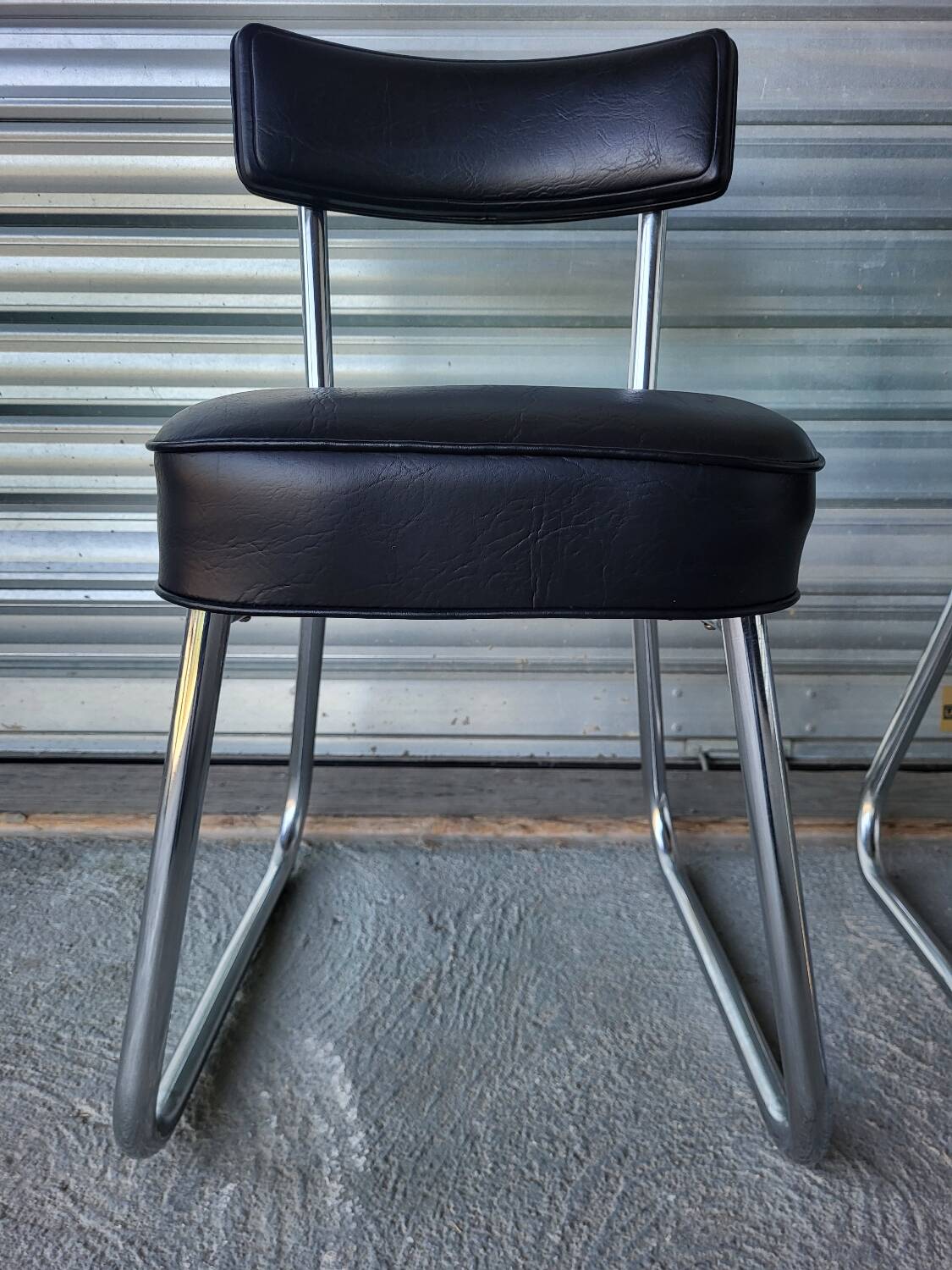 Pair of vintage black and chrome leatherette office chairs in very good condition