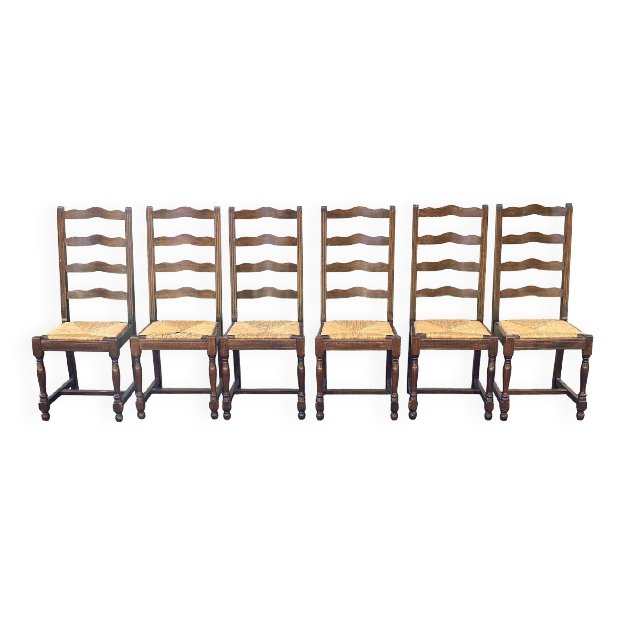 6 solid wood chairs in dark oak with a glossy finish and straw.