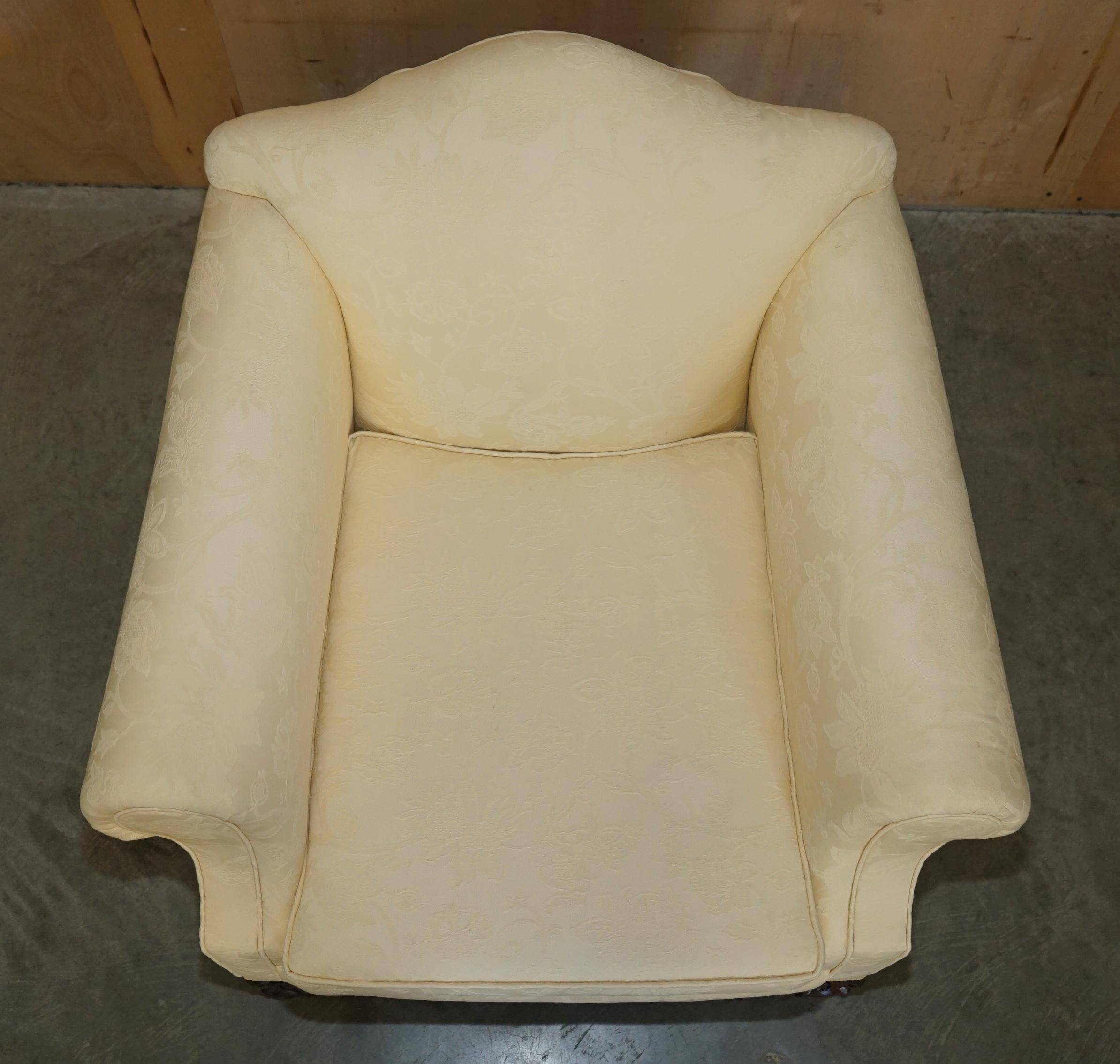 Pair of Edwardian armchairs from 1910 with carved legs and fabric.