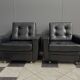 2 Black leather arm chairs 1960s on wheels