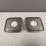 A set of classic Danish candlesticks in polished metal.