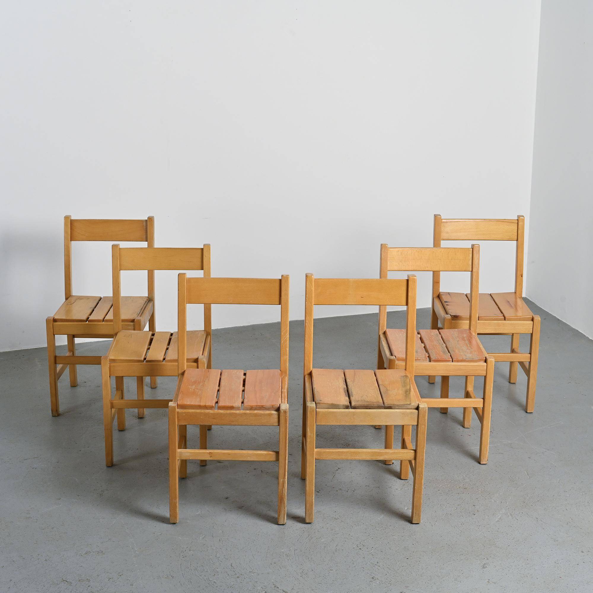 Set of six solid pine chairs by Maison Regain.