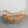 Suite de six chaises en pin massif par Maison Regain