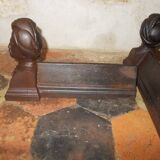 Old cast iron andirons with oriental decor